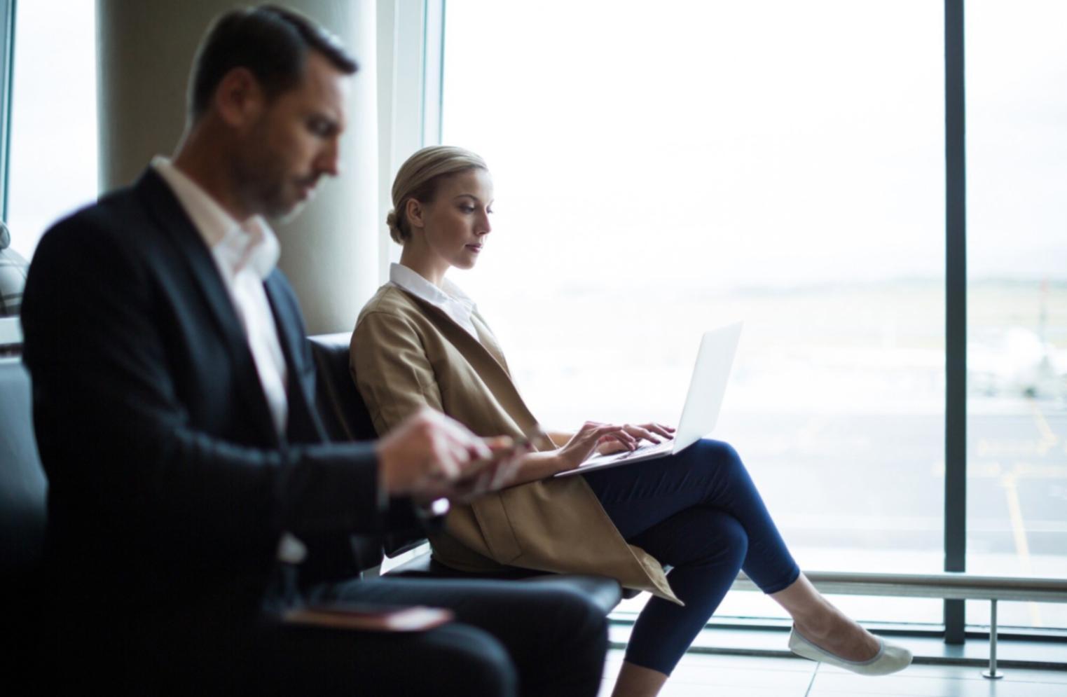 Business owner reviewing solvency metrics on laptop